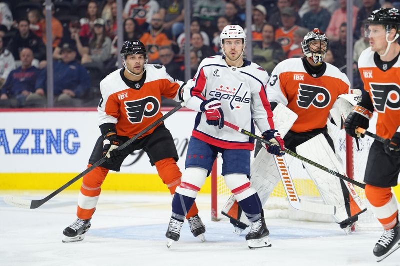 Mar 11, 2026; Philadelphia, Pennsylvania, USA; Washington Capitals left wing Anthony Beauvillier (72) and Philadelphia Flyers defenseman Noah Juulsen (47) battle for position in the first period at Xfinity Mobile Arena. Mandatory Credit: Kyle Ross-Imagn Images