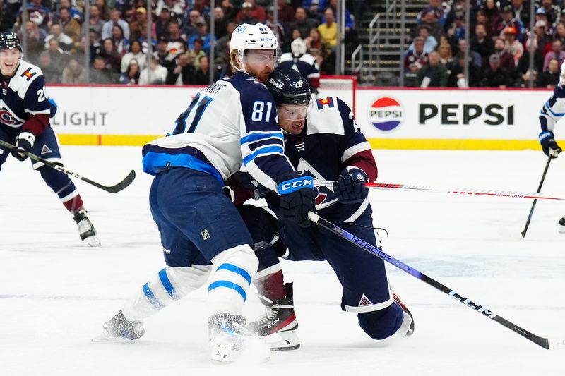 Dec 7, 2023; Denver, Colorado, USA; Winnipeg Jets left wing Kyle Connor (81) collides into Colorado Avalanche left wing Miles Wood (28) in the second period at Ball Arena. Mandatory Credit: Ron Chenoy-USA TODAY Sports