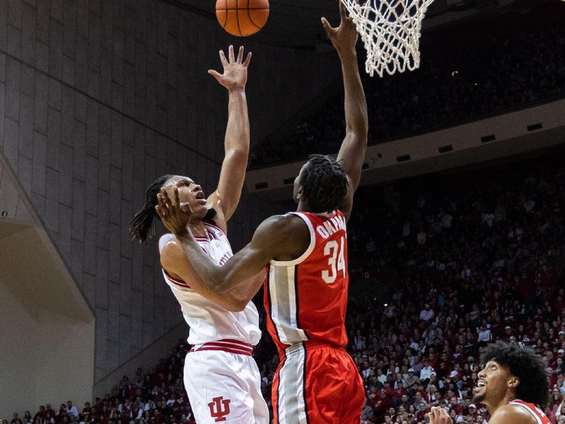 Jan 28, 2023; Bloomington, Indiana, USA; Indiana Hoosiers forward Malik Reneau (5) shoots the ball while Ohio State Buckeyes center Felix Okpara (34) defends in the first half at Simon Skjodt Assembly Hall. Mandatory Credit: Trevor Ruszkowski-USA TODAY Sports