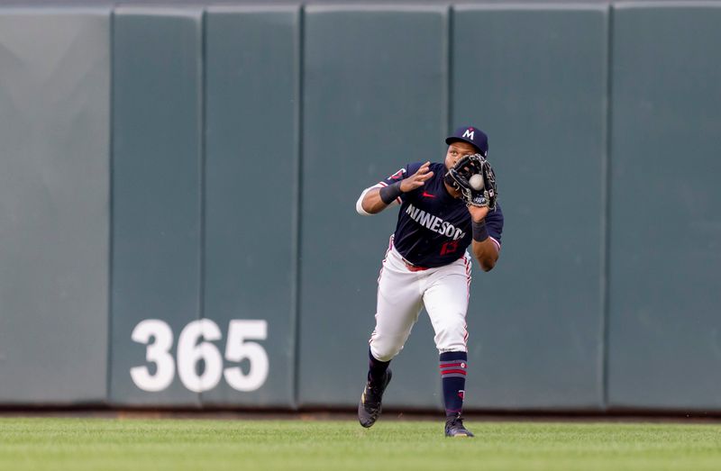 May 14, 2024; Minneapolis, Minnesota, USA; Minnesota Twins right fielder Manuel Margot (13) catches a fly ball against the New York Yankees in the fourth inning at Target Field. Mandatory Credit: Jesse Johnson-USA TODAY Sports