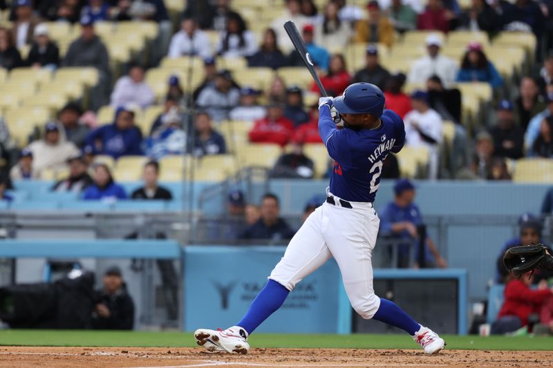 Mar 24, 2024; Los Angeles, California, USA;  Los Angeles Dodgers right fielder Jason Heyward (23) hits an RBI double during the second inning against the Los Angeles Angels at Dodger Stadium. Mandatory Credit: Kiyoshi Mio-USA TODAY Sports