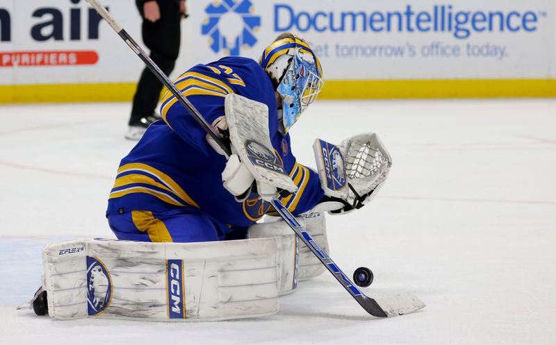 Dec 21, 2023; Buffalo, New York, USA;  Buffalo Sabres goaltender Devon Levi (27) makes a pad save during the third period against the Toronto Maple Leafs at KeyBank Center. Mandatory Credit: Timothy T. Ludwig-USA TODAY Sports