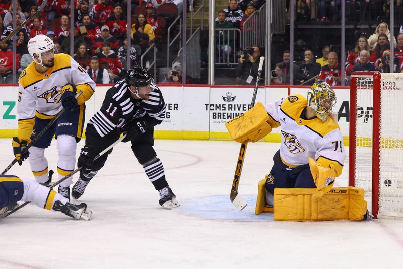 Nov 25, 2024; Newark, New Jersey, USA; New Jersey Devils center Nico Hischier (13) (not shown) scores a goal on Nashville Predators goaltender Juuse Saros (74) during the second period at Prudential Center. Mandatory Credit: Ed Mulholland-Imagn Images