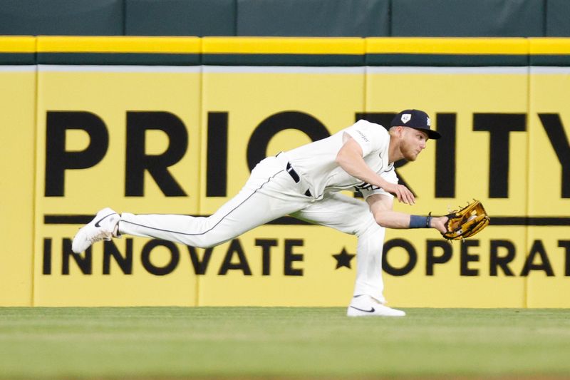 Apr 15, 2024; Detroit, Michigan, USA; Detroit Tigers center fielder Parker Meadows catches a fly ball against the Texas Rangers at Comerica Park. Mandatory Credit: Brian Bradshaw Sevald-USA TODAY Sports