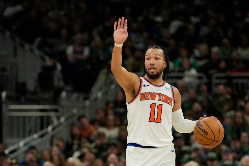 MILWAUKEE, WISCONSIN - APRIL 07: Jalen Brunson #11 of the New York Knicks dribbles the ball during the second half against the Milwaukee Bucks at Fiserv Forum on April 07, 2024 in Milwaukee, Wisconsin. NOTE TO USER: User expressly acknowledges and agrees that, by downloading and or using this photograph, User is consenting to the terms and conditions of the Getty Images License Agreement. (Photo by Patrick McDermott/Getty Images)