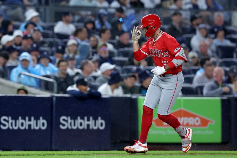 Aug 7, 2024; Bronx, New York, USA; Los Angeles Angels shortstop Zach Neto (9) gestures as he rounds the bases after hitting a grand slam home run against the New York Yankees during the second inning at Yankee Stadium. Mandatory Credit: Brad Penner-USA TODAY Sports