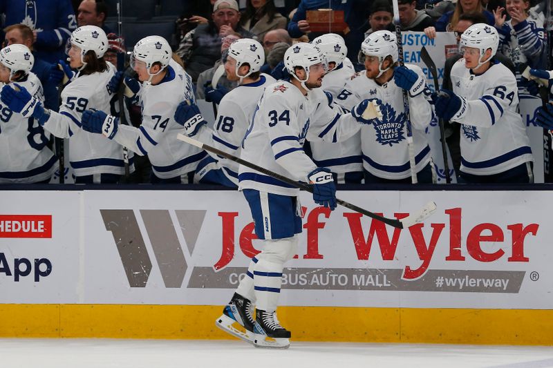 Dec 23, 2023; Columbus, Ohio, USA; Toronto Maple Leafs center Auston Matthews (34) celebrates his goal against the Columbus Blue Jackets during the first period at Nationwide Arena. Mandatory Credit: Russell LaBounty-USA TODAY Sports