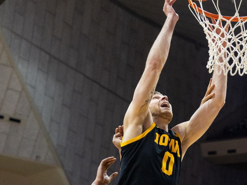 Feb 28, 2023; Bloomington, Indiana, USA; Iowa Hawkeyes forward Filip Rebraca (0) shoots the ball while Indiana Hoosiers forward Malik Reneau (5) defends in the second half at Simon Skjodt Assembly Hall. Mandatory Credit: Trevor Ruszkowski-USA TODAY Sports