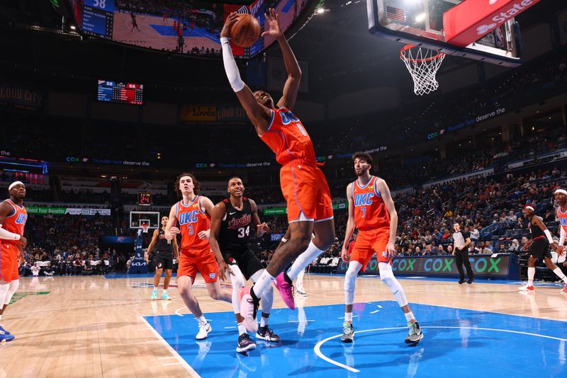 OKLAHOMA CITY, OK - JANUARY 23: Jalen Williams #8 of the Oklahoma City Thunder grabs the rebound during the game against the Portland Trail Blazers on January 23, 2024 at Paycom Arena in Oklahoma City, Oklahoma. NOTE TO USER: User expressly acknowledges and agrees that, by downloading and or using this photograph, User is consenting to the terms and conditions of the Getty Images License Agreement. Mandatory Copyright Notice: Copyright 2024 NBAE (Photo by Zach Beeker/NBAE via Getty Images)