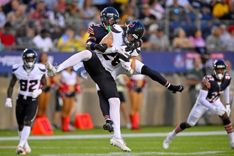 Houston Texans wide receiver Ben Skowronek (26) makes a catch for a first down with Chicago Bears cornerback Jaylon Jones (21) defending during the beginning of an NFL exhibition Hall of Fame football game, in Canton, Ohio, Thursday, Aug. 1, 2024. (AP Photo/Gene J. Puskar)