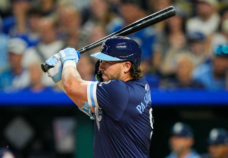 Sep 19, 2025; Kansas City, Missouri, USA; Kansas City Royals first baseman Vinnie Pasquantino (9) hits an RBI single during the third inning against the Toronto Blue Jays at Kauffman Stadium. Mandatory Credit: Jay Biggerstaff-Imagn Images