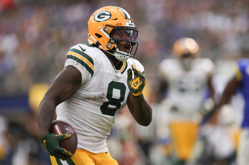 Green Bay Packers running back Josh Jacobs (8) runs the ball during the second half of an NFL football game against the Los Angeles Rams Sunday, Oct. 6, 2024, in Inglewood, Calif. (AP Photo/Ryan Sun)