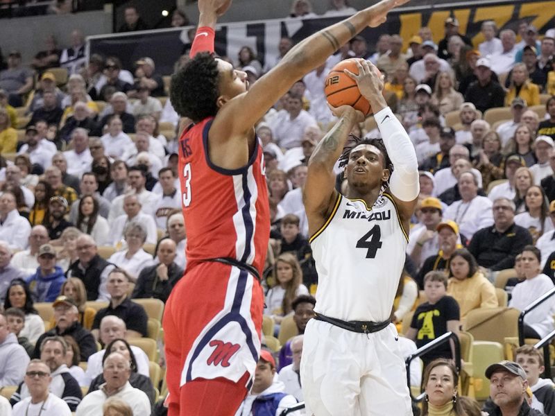 Mar 4, 2023; Columbia, Missouri, USA; Missouri Tigers guard DeAndre Gholston (4) shoots a jump shot as Mississippi Rebels forward Myles Burns (3) defends during the first half at Mizzou Arena. Mandatory Credit: Denny Medley-USA TODAY Sports