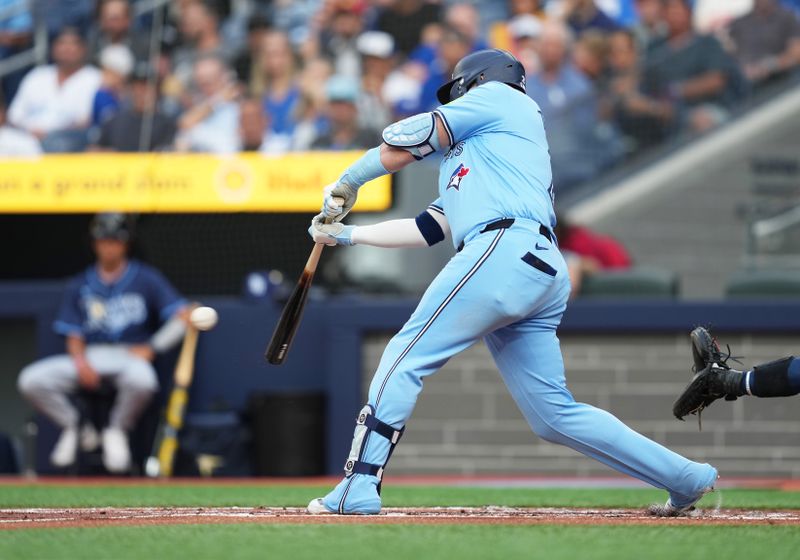 Jul 23, 2024; Toronto, Ontario, CAN; Toronto Blue Jays designated hitter Justin Turner (2) hits a single against the Tampa Bay Rays during the first inning at Rogers Centre. Mandatory Credit: Nick Turchiaro-USA TODAY Sports