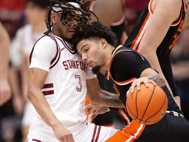 Feb 24, 2024; Stanford, California, USA; Oregon State Beavers guard Jordan Pope (right) collides with Stanford Cardinal guard Kanaan Carlyle (3) during the first half at Maples Pavilion. Mandatory Credit: D. Ross Cameron-USA TODAY Sports