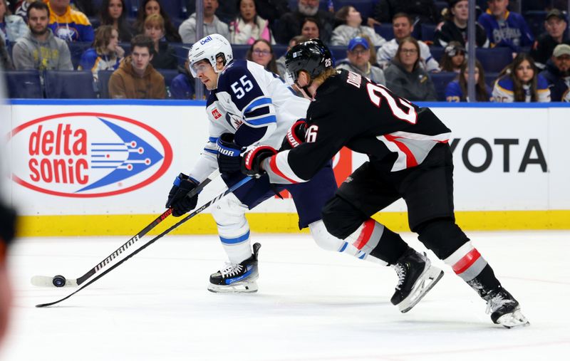 Mar 3, 2024; Buffalo, New York, USA;  Buffalo Sabres defenseman Rasmus Dahlin (26) looks to block a shot by Winnipeg Jets center Mark Scheifele (55) during the first period at KeyBank Center. Mandatory Credit: Timothy T. Ludwig-USA TODAY Sports