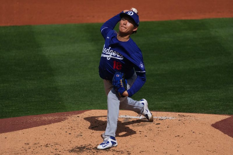 Feb 28, 2024; Surprise, Arizona, USA; Los Angeles Dodgers starting pitcher Yoshinobu Yamamoto (18) pitches during the third inning against the Texas Rangers at Surprise Stadium. Mandatory Credit: Joe Camporeale-USA TODAY Sports