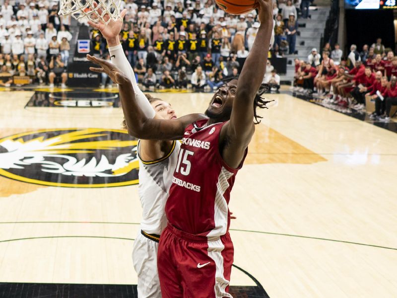 Jan 31, 2024; Columbia, Missouri, USA; Arkansas Razorbacks forward Makhi Mitchell (15) shoots against Missouri Tigers forward Noah Carter (35) during the first half at Mizzou Arena. Mandatory Credit: Jay Biggerstaff-USA TODAY Sports