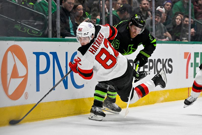 Mar 14, 2024; Dallas, Texas, USA; New Jersey Devils defenseman Santeri Hatakka (82) falls to the ice in front of Dallas Stars center Joe Pavelski (16) during the second period at the American Airlines Center. Mandatory Credit: Jerome Miron-USA TODAY Sports