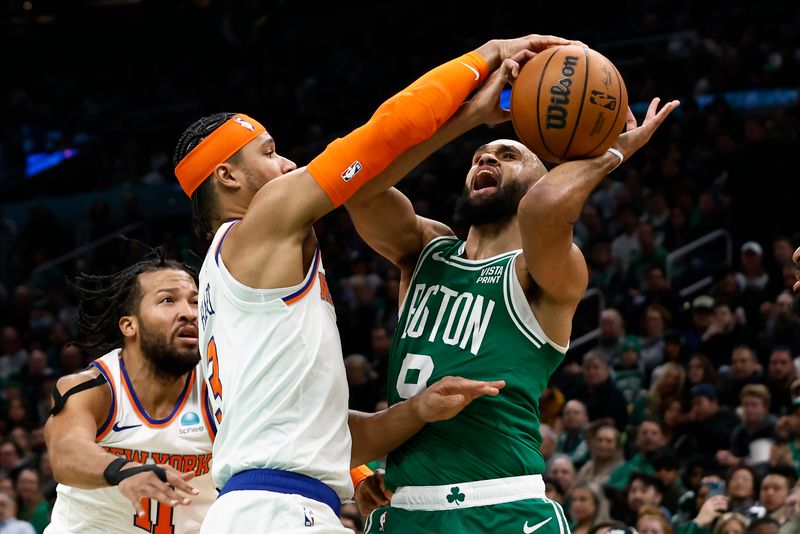 BOSTON, MA - DECEMBER 8: Derrick White #9 of the Boston Celtics is stopped going to the basket by Josh Hart #3 of the New York Knicks during the second half at TD Garden on December 8, 2023 in Boston, Massachusetts. NOTE TO USER: User expressly acknowledges and agrees that, by downloading and/or using this Photograph, user is consenting to the terms and conditions of the Getty Images License Agreement. (Photo By Winslow Townson/Getty Images)