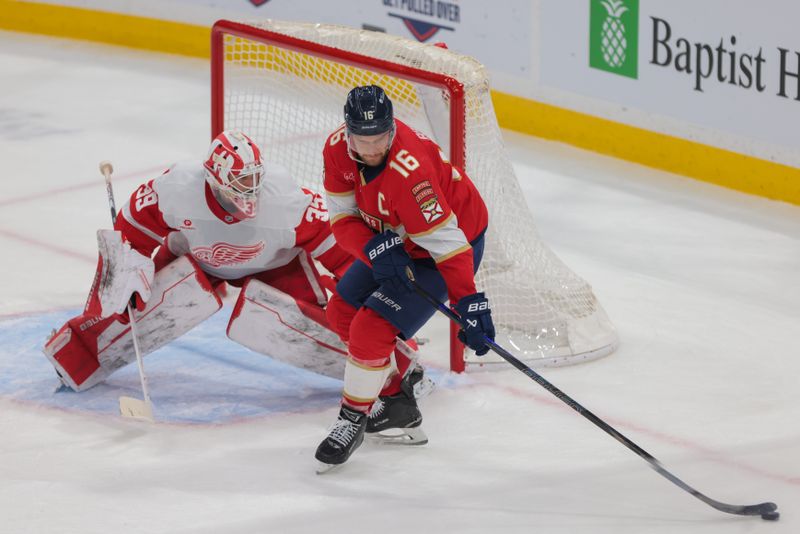 Jan 16, 2025; Sunrise, Florida, USA; Florida Panthers center Aleksander Barkov (16) controls the puck in front of Detroit Red Wings goaltender Cam Talbot (39) during the second period at Amerant Bank Arena. Mandatory Credit: Sam Navarro-Imagn Images