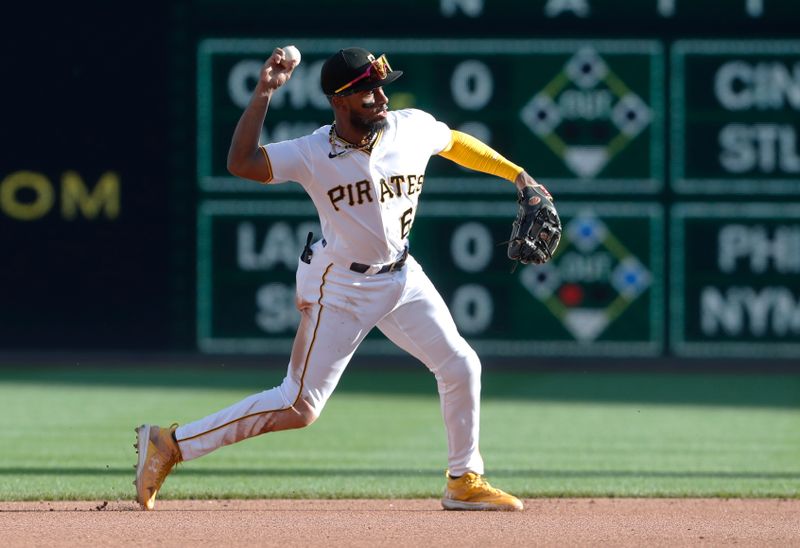 Oct 1, 2023; Pittsburgh, Pennsylvania, USA;  Pittsburgh Pirates shortstop Liover Peguero (60) throws to first base for an out against the Miami Marlins during the seventh inning at PNC Park. Pittsburgh won 3-0. Mandatory Credit: Charles LeClaire-USA TODAY Sports