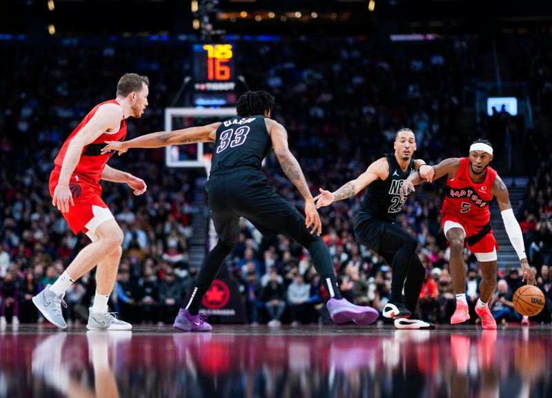 TORONTO, ON - JANUARY 1: Immanuel Quickley #5 of the Toronto Raptors dribbles against Jalen Wilson #22 of the Brooklyn Nets during the first half of their basketball game at the Scotiabank Arena on January 1, 2025 in Toronto, Ontario, Canada. NOTE TO USER: User expressly acknowledges and agrees that, by downloading and/or using this Photograph, user is consenting to the terms and conditions of the Getty Images License Agreement. (Photo by Mark Blinch/Getty Images)
