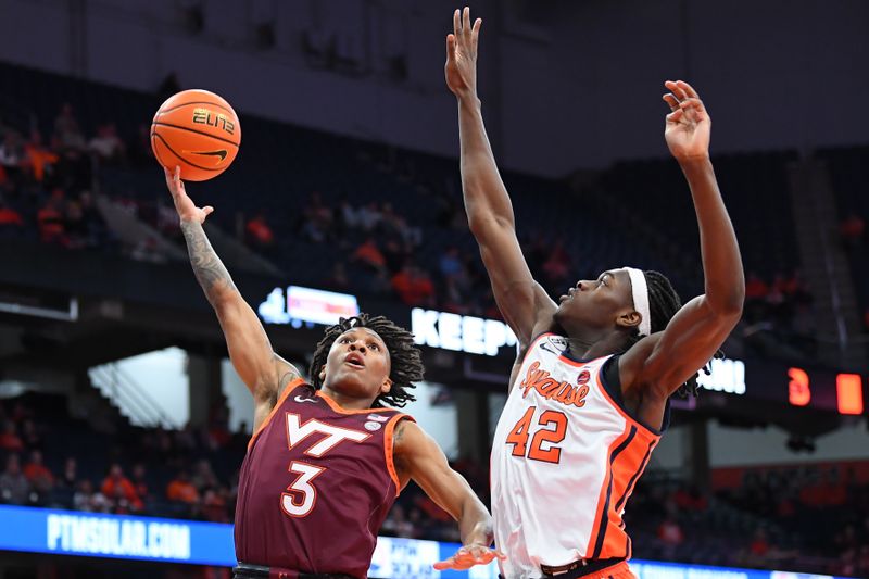 Jan 21, 2026; Syracuse, New York, USA; Virginia Tech Hokies guard Ben Hammond (3) shoots against Syracuse Orange forward William Kyle III (42) during the first half at the JMA Wireless Dome. Mandatory Credit: Rich Barnes-Imagn Images
