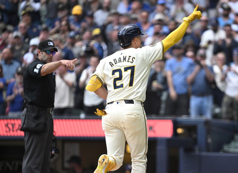 May 1, 2024; Milwaukee, Wisconsin, USA; Milwaukee Brewers shortstop Willy Adames (27) crosses home plate after hitting a home run against the Tampa Bay Rays in the seventh inning at American Family Field. Mandatory Credit: Michael McLoone-USA TODAY Sports