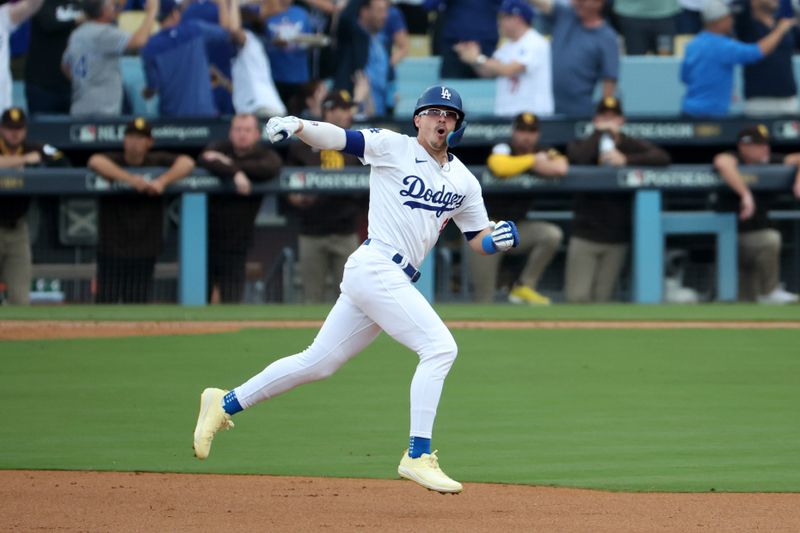 Oct 11, 2024; Los Angeles, California, USA; Los Angeles Dodgers third baseman Enrique Hernandez (8) runs after hitting a solo home run in the second inning against the San Diego Padres during game five of the NLDS for the 2024 MLB Playoffs at Dodger Stadium. Mandatory Credit: Kiyoshi Mio-Imagn Images