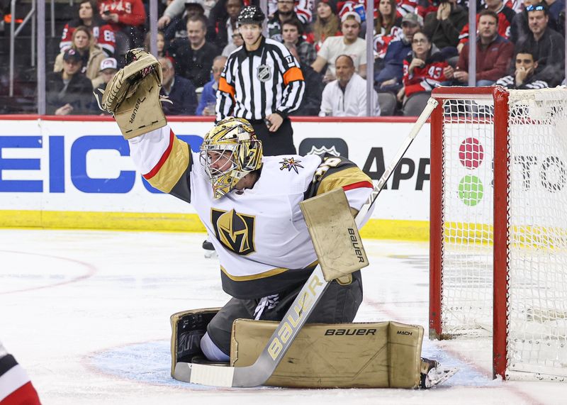 Jan 22, 2024; Newark, New Jersey, USA; Vegas Golden Knights goaltender Logan Thompson (36) makes a glove save during the third period against the New Jersey Devils at Prudential Center. Mandatory Credit: Vincent Carchietta-USA TODAY Sports