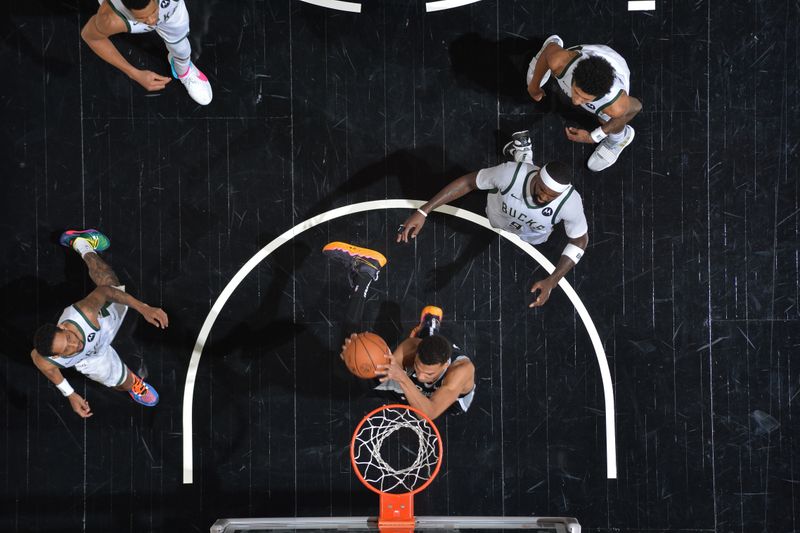 SAN ANTONIO, TX - JANUARY 4: Victor Wembanyama #1 of the San Antonio Spurs dunks the ball during the game against the Milwaukee Bucks on January 4, 2024 at the Frost Bank Center in San Antonio, Texas. NOTE TO USER: User expressly acknowledges and agrees that, by downloading and or using this photograph, user is consenting to the terms and conditions of the Getty Images License Agreement. Mandatory Copyright Notice: Copyright 2024 NBAE (Photos by Michael Gonzales/NBAE via Getty Images)