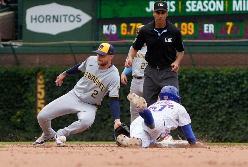 Jul 24, 2024; Chicago, Illinois, USA; Chicago Cubs third baseman Miles Mastrobuoni (20) steals second base against Milwaukee Brewers second baseman Brice Turang (2) during the seventh inning at Wrigley Field. Mandatory Credit: David Banks-USA TODAY Sports