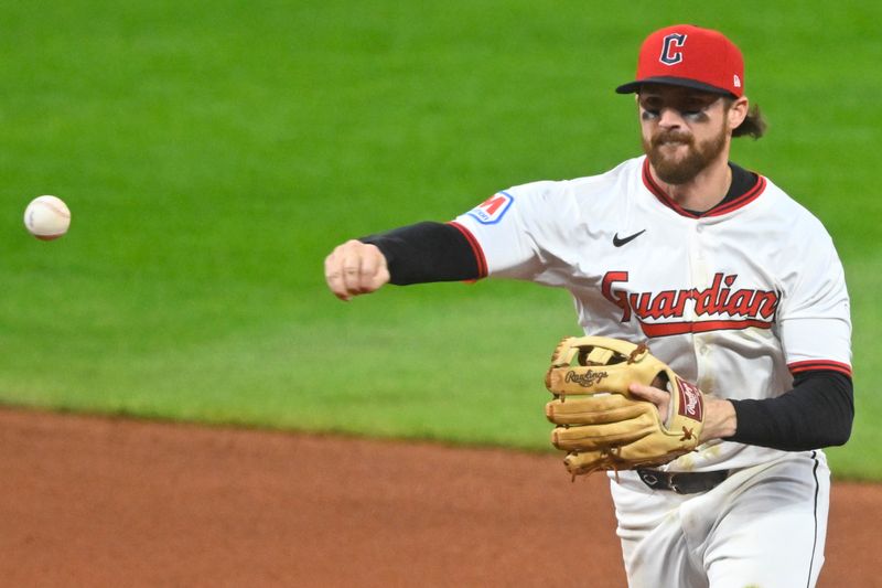Sep 10, 2025; Cleveland, Ohio, USA; Cleveland Guardians second baseman Daniel Schneemann (10) throws to first base in the fourth inning against the Kansas City Royals at Progressive Field. Mandatory Credit: David Richard-Imagn Images