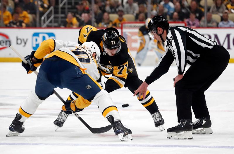 Apr 15, 2024; Pittsburgh, Pennsylvania, USA;  Nashville Predators center Colton Sissons (10) and Pittsburgh Penguins center Evgeni Malkin (71) take a face-off during the first period at PPG Paints Arena. The Penguins won 4-2. Mandatory Credit: Charles LeClaire-USA TODAY Sports