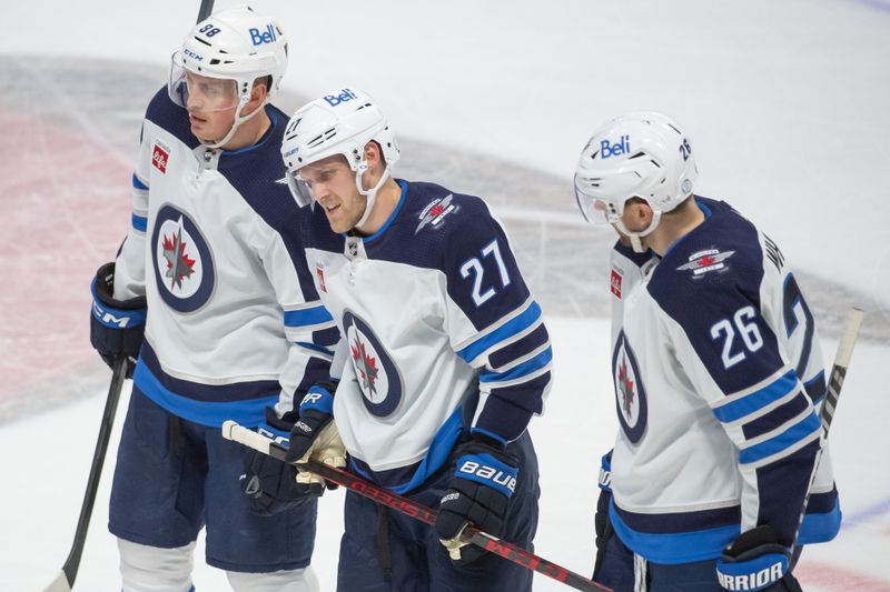 Jan 21, 2023; Ottawa, Ontario, CAN; Winnipeg Jets left wing Nikolaj Ehlers (27) skates off the ice in discomfort in the third period against the Ottawa Senators at the Canadian Tire Centre. Mandatory Credit: Marc DesRosiers-USA TODAY Sports