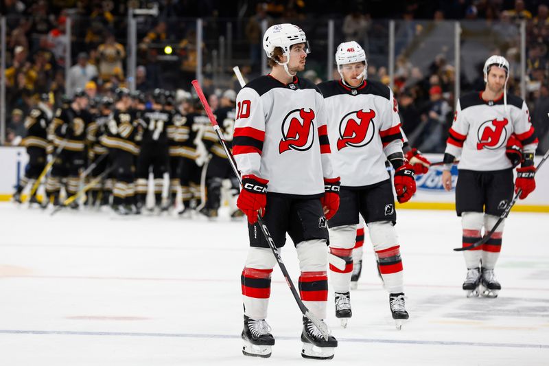 Jan 15, 2024; Boston, Massachusetts, USA; New Jersey Devils right wing Alexander Holtz (10) and teammates head for the locker room as the Boston Bruins congratulate each other after their 3-0 win at TD Garden. Mandatory Credit: Winslow Townson-USA TODAY Sports