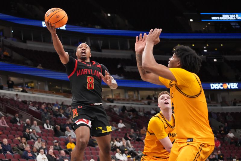 Mar 11, 2026; Chicago, IL, USA; Iowa Hawkeyes guard Tavion Banks (6) defends Maryland Terrapins guard David Coit (8) during the second half at United Center. Mandatory Credit: David Banks-Imagn Images