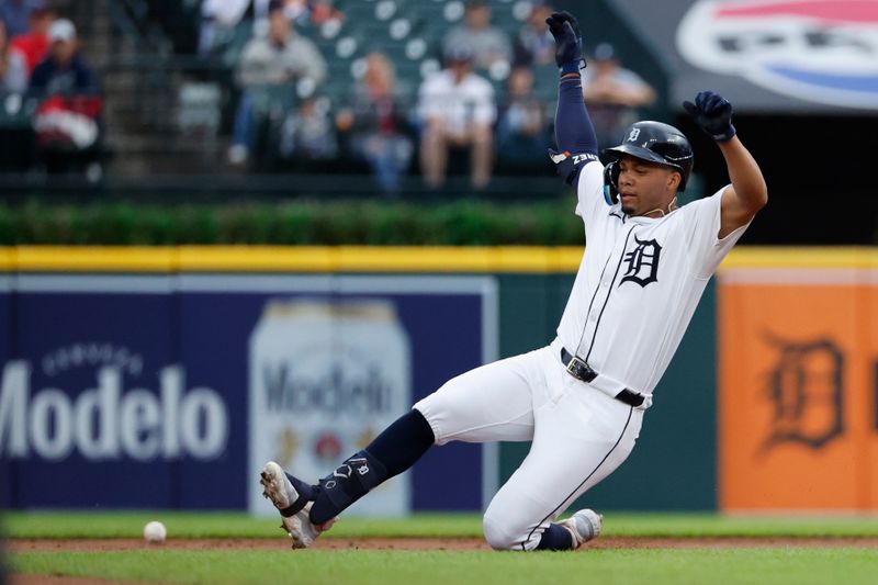 Jul 10, 2024; Detroit, Michigan, USA;  Detroit Tigers outfielder Wenceel Pérez (46) slides in safe after hitting a double in the first inning against the Cleveland Guardians at Comerica Park. Mandatory Credit: Rick Osentoski-USA TODAY Sports