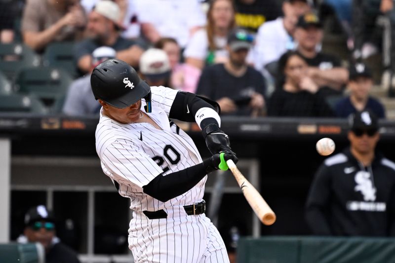 Jun 7, 2025; Chicago, Illinois, USA;  Chicago White Sox third baseman Miguel Vargas (20) singles during the eighth inning against the Kansas City Royals at Rate Field. Mandatory Credit: Matt Marton-Imagn Images