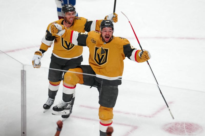 Apr 14, 2024; Las Vegas, Nevada, USA; Vegas Golden Knights center Tomas Hertl (48) celebrates with Vegas Golden Knights right wing Jonathan Marchessault (81) after scoring a goal against the Colorado Avalanche during an overtime period to give the Golden Knights a 4-3 victory at T-Mobile Arena. Mandatory Credit: Stephen R. Sylvanie-USA TODAY Sports