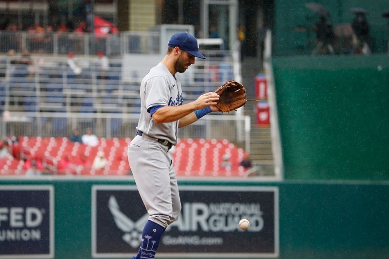 Sep 10, 2023; Washington, District of Columbia, USA; Los Angeles Dodgers third baseman Chris Taylor (3) misses a fly ball in the fourth inning against the Washington Nationals at Nationals Park. Mandatory Credit: Amber Searls-USA TODAY Sports