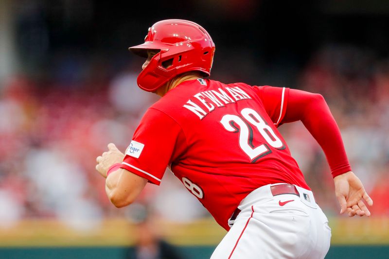 Aug 8, 2023; Cincinnati, Ohio, USA; Cincinnati Reds designated hitter Kevin Newman (28) leads off from first in the second inning against the Miami Marlins at Great American Ball Park. Mandatory Credit: Katie Stratman-USA TODAY Sports