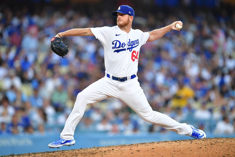 Jul 29, 2023; Los Angeles, California, USA; Los Angeles Dodgers relief pitcher Caleb Ferguson (64) throws against the Cincinnati Reds during the sixth inning at Dodger Stadium. Mandatory Credit: Gary A. Vasquez-USA TODAY Sports