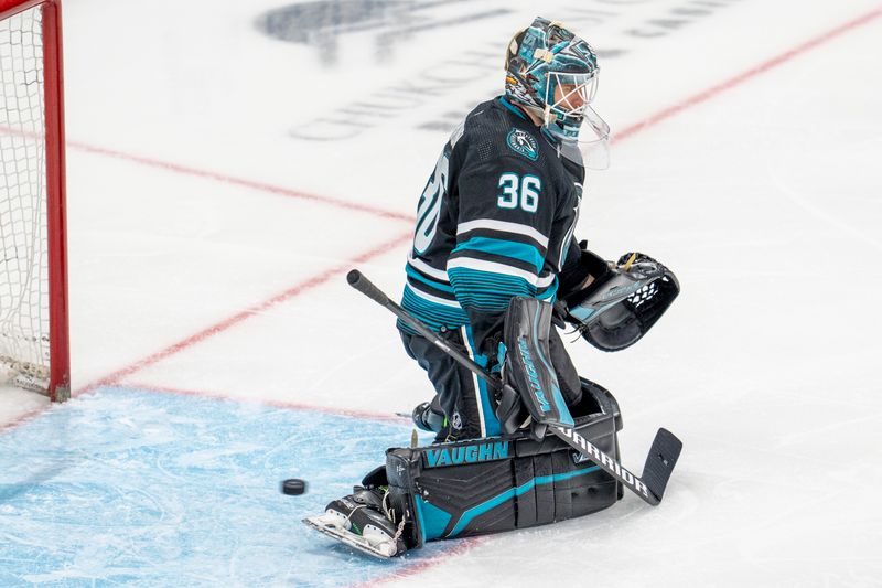 Feb 27, 2024; San Jose, California, USA;  San Jose Sharks goaltender Kaapo Kahkonen (36) cannot stop the shot on goal against the New Jersey Devils during the third period at SAP Center at San Jose. Mandatory Credit: Neville E. Guard-USA TODAY Sports