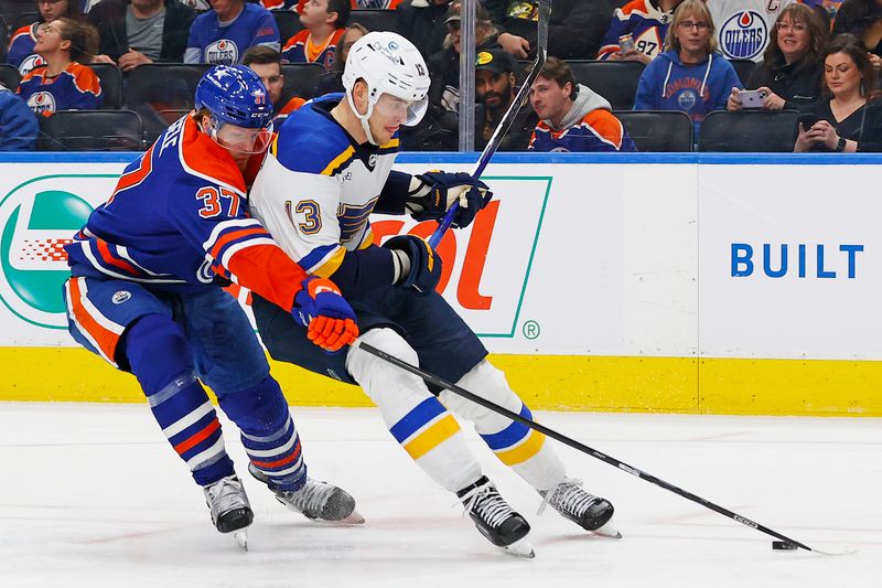 Feb 28, 2024; Edmonton, Alberta, CAN; Edmonton Oilers forward Warren Foegele (37) knocks the puck away from St. Louis Blues forward Alexey Toropchenko (13) during the second period at Rogers Place. Mandatory Credit: Perry Nelson-USA TODAY Sports