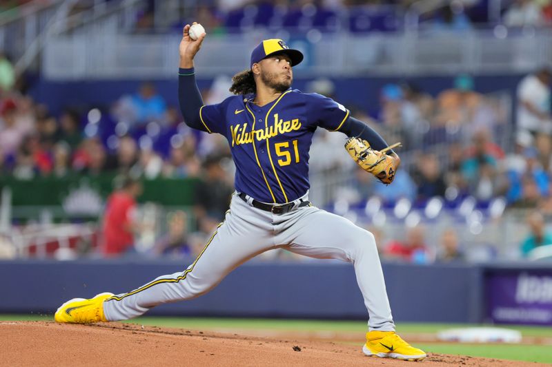 Sep 24, 2023; Miami, Florida, USA; Milwaukee Brewers starting pitcher Freddy Peralta (51) delivers a pitch against the Miami Marlins during the first inning at loanDepot Park. Mandatory Credit: Sam Navarro-USA TODAY Sports