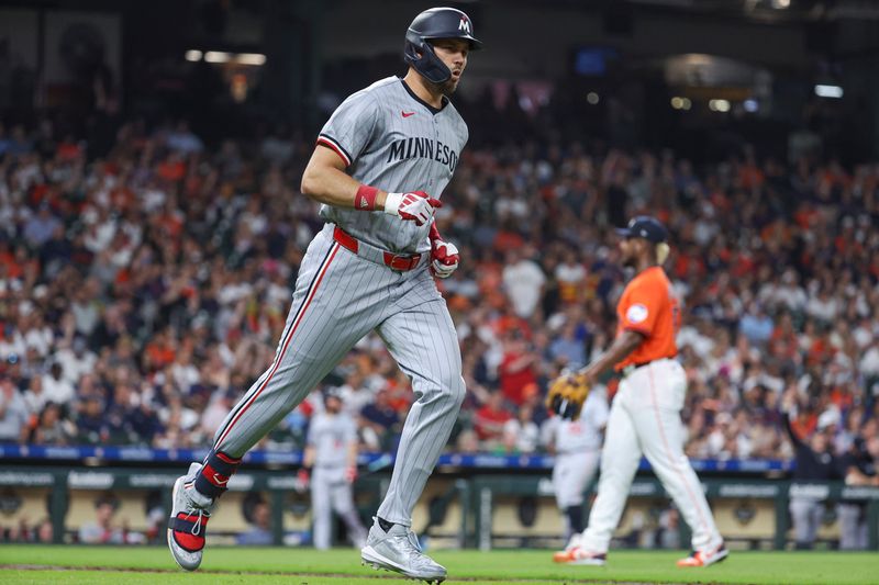 May 31, 2024; Houston, Texas, USA; Houston Astros starting pitcher Ronel Blanco (56) reacts and Minnesota Twins designated hitter Trevor Larnach (9) rounds the bases after hitting a home run during the fifth inning at Minute Maid Park. Mandatory Credit: Troy Taormina-USA TODAY Sports