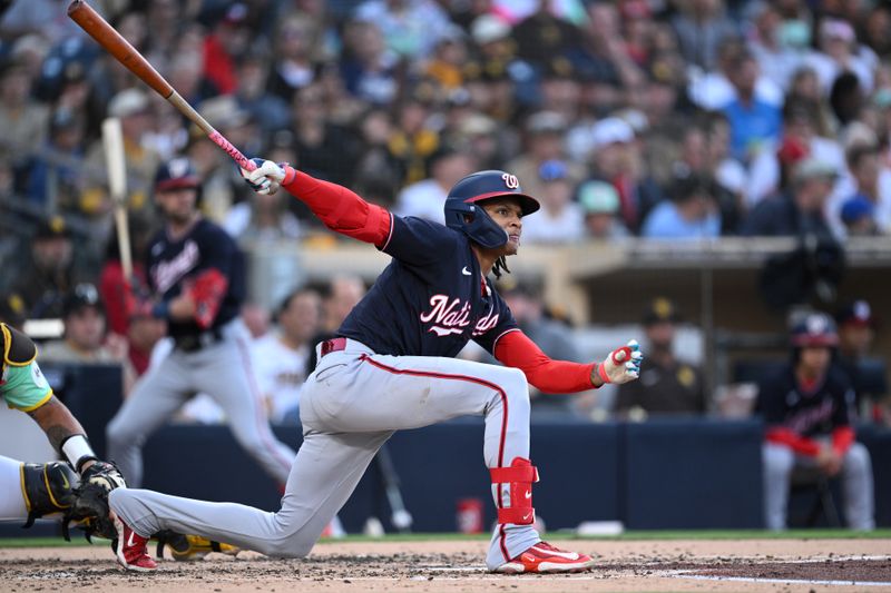 Jun 23, 2023; San Diego, California, USA; Washington Nationals shortstop C.J. Abrams (5) hits a double against the San Diego Padres during the third inning at Petco Park. Mandatory Credit: Orlando Ramirez-USA TODAY Sports