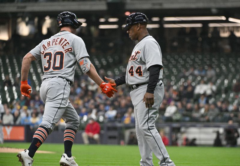 Apr 25, 2023; Milwaukee, Wisconsin, USA; Detroit Tigers right fielder Kerry Carpenter (30) is congratulated by third base coach Gary Jones (44) after hitting a home run against the Milwaukee Brewers in the second inning at American Family Field. Mandatory Credit: Michael McLoone-USA TODAY Sports